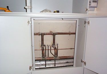 Access To Pipes Was Maintained With Removable Back Panel