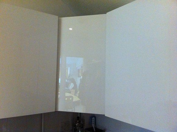 Water Heater Behind White Gloss Panel