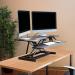 Sora Sit Stand Desk Converter Used On A Desk With Two Monitors