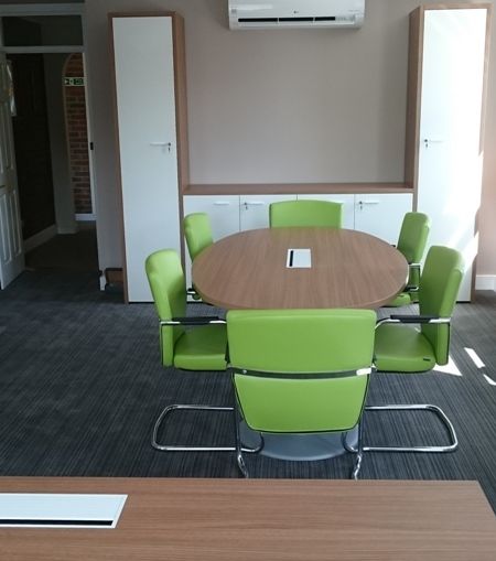 Office Storage Cupboards Behind Meeting Table