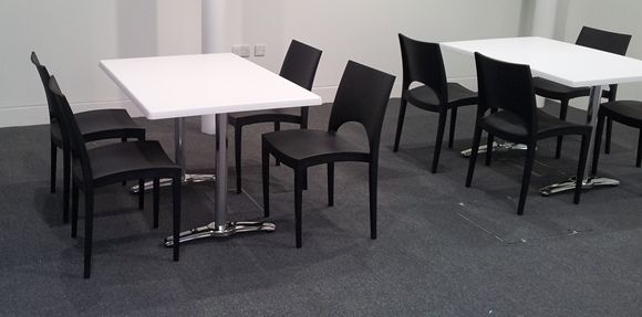 Black Colour Moon Chairs Around Cafe Tables