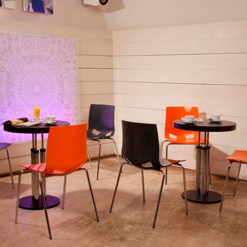 Stylish Fondo cafe chairs in anthracite and vibrant orange finishes. 
